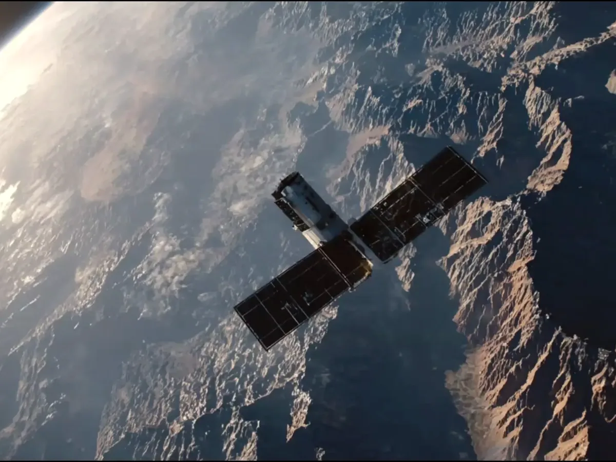 Earth-observation satellite over arid mountain terrain